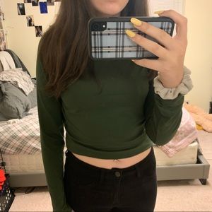 Slightly cropped dark green low turtleneck